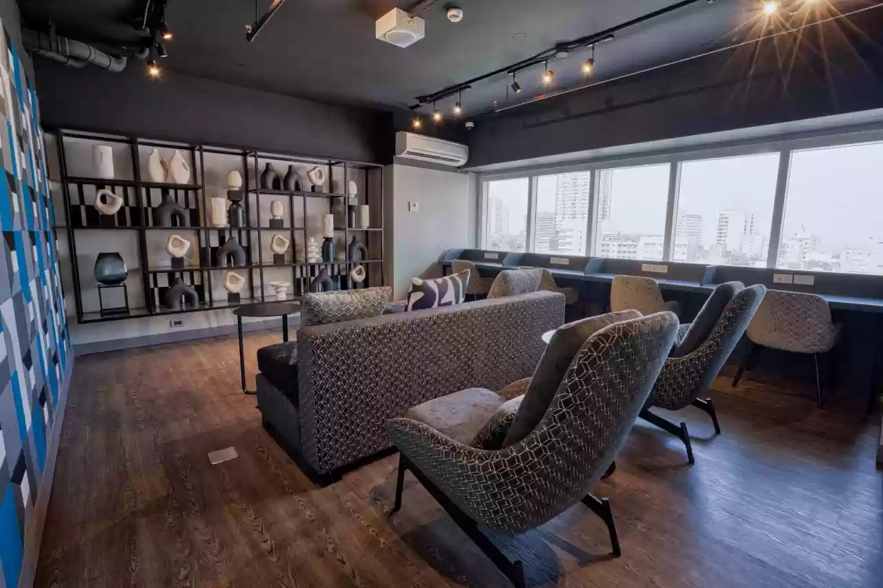 a condo amenity resident's lounge with chairs and a table