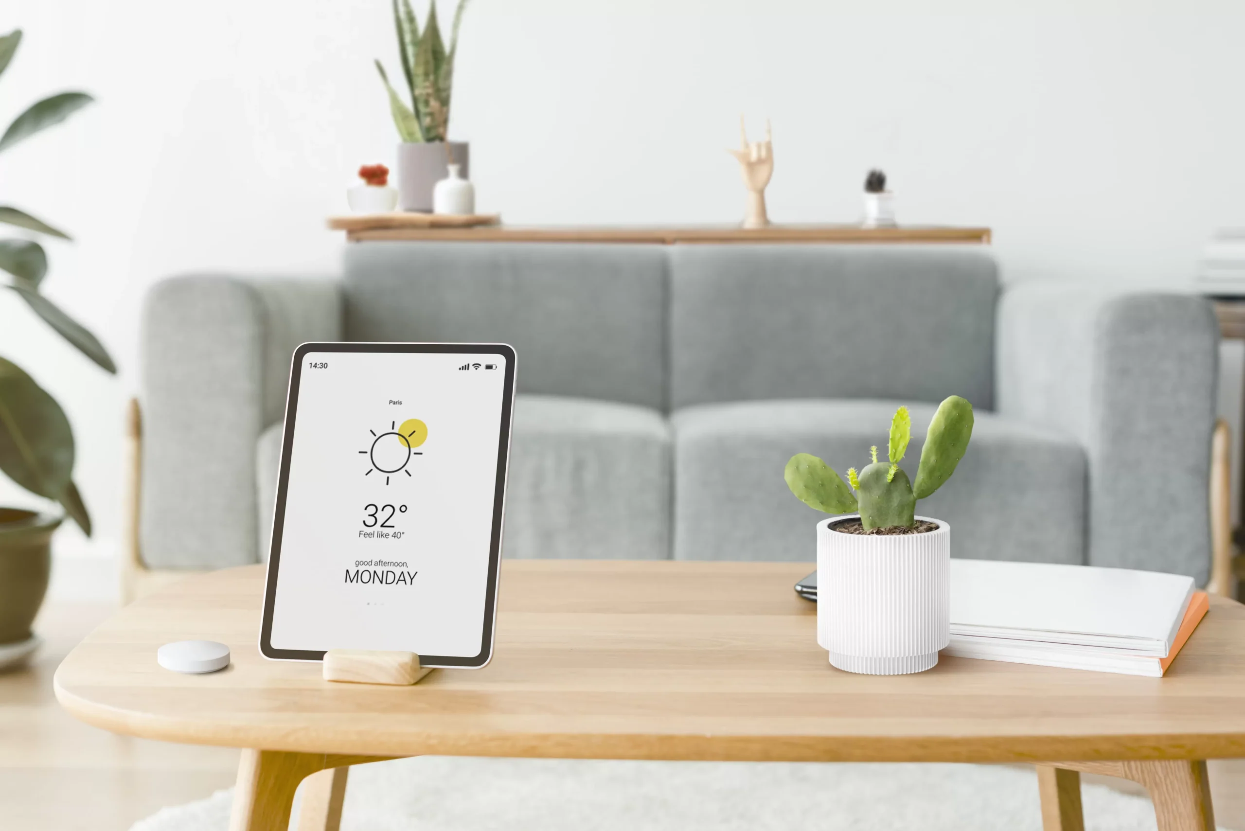 digital tablet screen with smart home controller wooden table