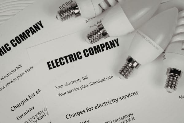 Electric company bills with energy-saving light bulbs